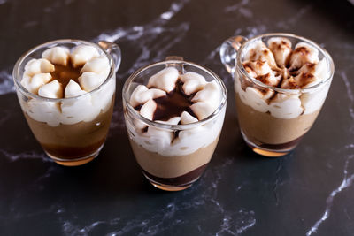 Assortment of mini chocolate desserts in the glass. mini choloate desserts on a rustic background