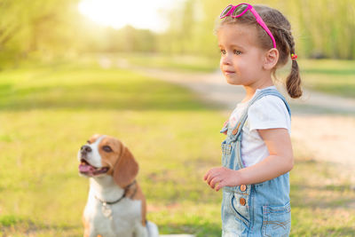 Girl with dog in park