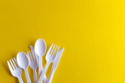 Close-up of fork over white background