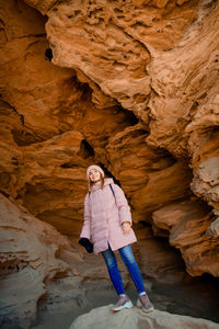 Woman standing on rock