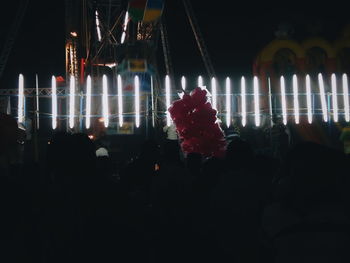 View of illuminated ferris wheel at night