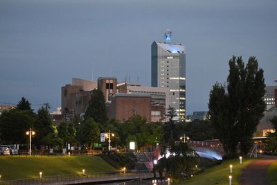City buildings against sky at night