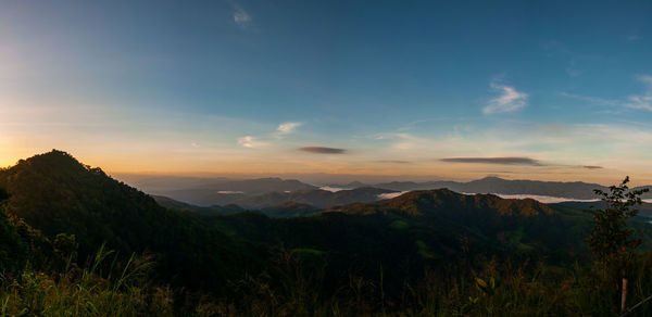 Scenic view of mountains against sky during sunset