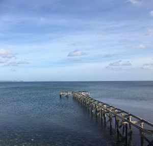 Pier over sea against sky