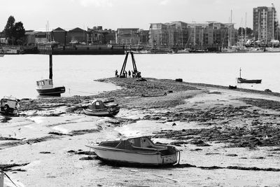 Boats moored at harbor