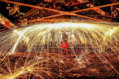 Full frame shot of illuminated lighting equipment at night