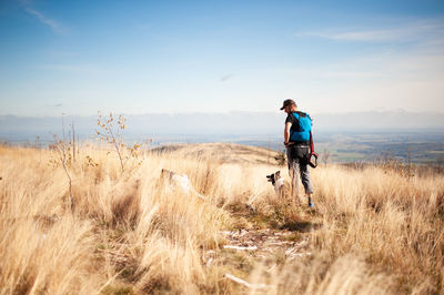 Full length of man on land against sky