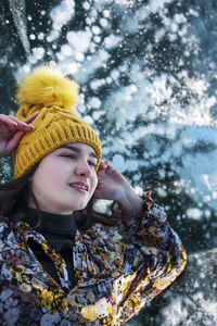 Portrait of young woman in water