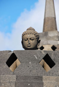 Low angle view of statue against sky