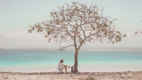 Man looking at sea against sky