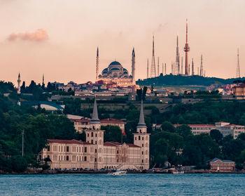 View of buildings against sky in city