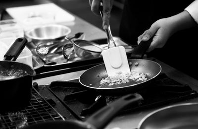 Midsection of man preparing food in kitchen