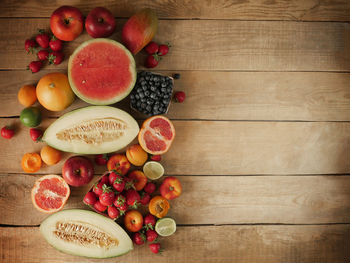 Composition with assorted raw organic fruits.