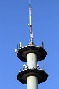 Low angle view of tower against clear blue sky