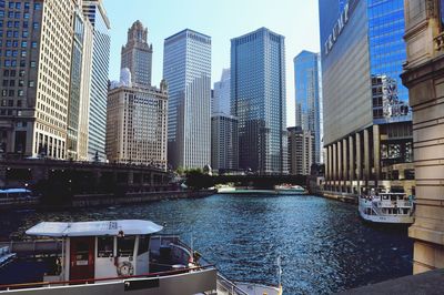 Modern buildings by river in city