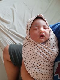 Cute baby sleeping in bed