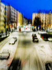 Blurred motion of road in city against clear sky