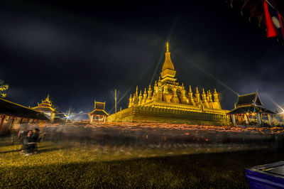Illuminated cathedral against sky at night
