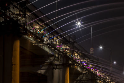 Low angle view of fountains on illuminated banpo bridge at night