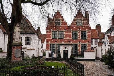 Houses in city against sky