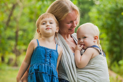 Side view of mother with daughter in park