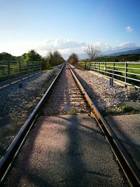 Railroad tracks against sky