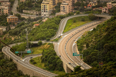 High angle view of road amidst trees in city