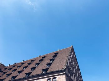 Low angle view of building against clear blue sky