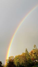 Low angle view of rainbow against sky