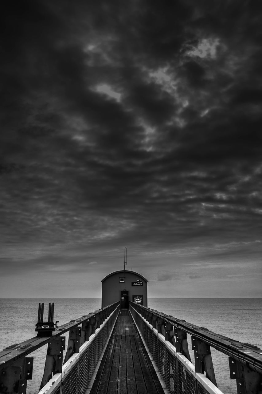 sea, horizon over water, sky, water, the way forward, railing, cloud - sky, cloudy, pier, tranquility, scenics, beauty in nature, diminishing perspective, nature, tranquil scene, beach, cloud, vanishing point, built structure, overcast