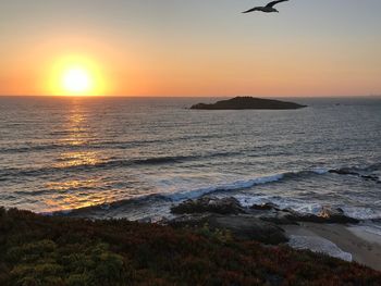 Scenic view of sea against sky during sunset