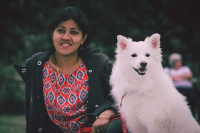 Portrait of smiling young woman with horse