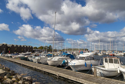 Boats moored at harbor