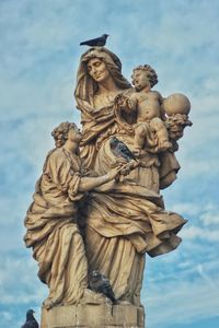 Low angle view of statue against sky