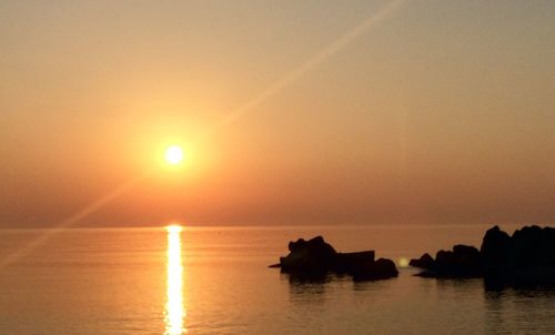 Scenic view of sea at sunset