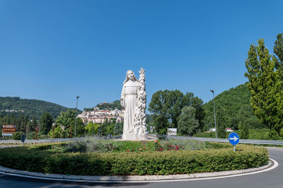 Statue against clear blue sky