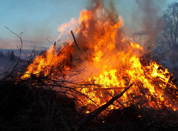 Bonfire against orange sky
