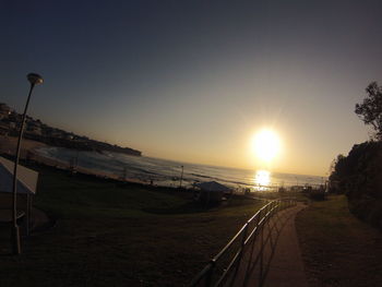 Scenic view of beach against sky during sunset