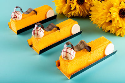 High angle view of yellow flowers on table