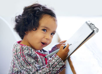 Portrait of young woman using mobile phone