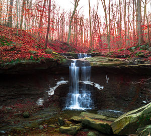 Scenic view of waterfall in river