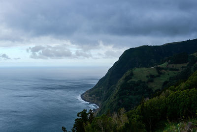 Landscape of the sea and greenish mountain in sao miguel, azores