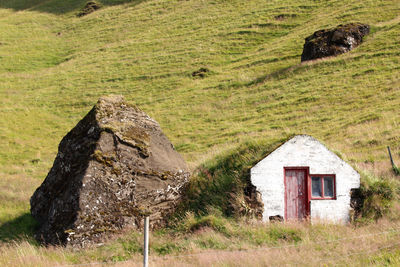 View of old house on field