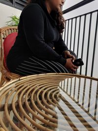 High angle view of young woman sitting at home