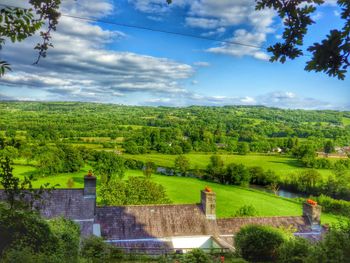 Scenic view of landscape against cloudy sky