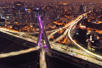 High angle view of light trails on city street at night