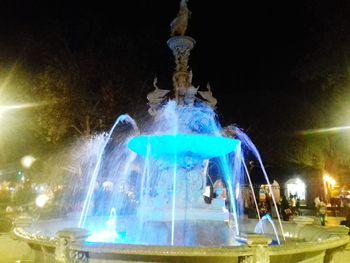 Low angle view of illuminated statue at night