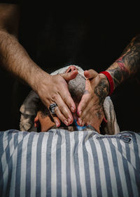 Close-up of man holding hands