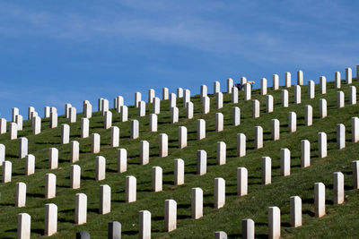 Tombstones against blue sky