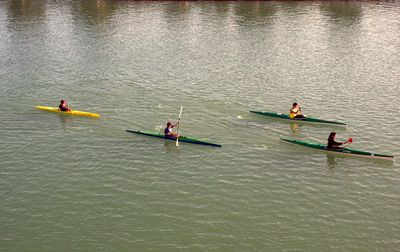 People enjoying boat in sea